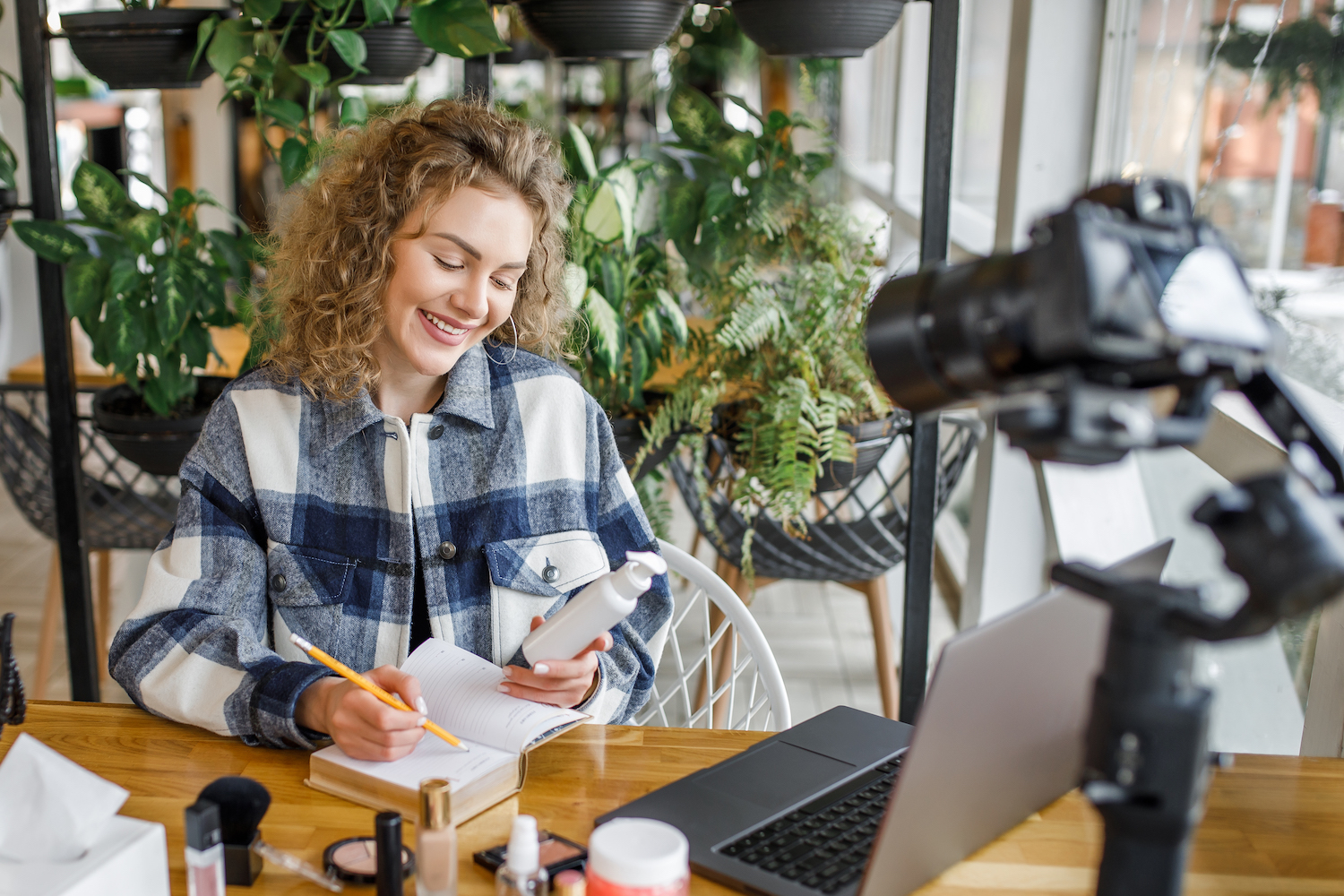 Pretty blonde woman, blogger and influencer testing new products on the camera